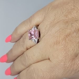 Pink Square cut ring with cubic zirconia accents.